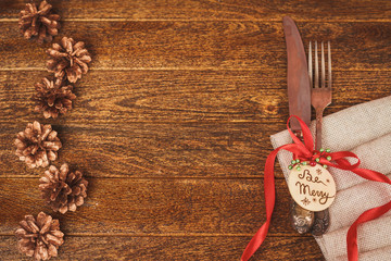 Christmas table place setting with christmas pine branches, ribb