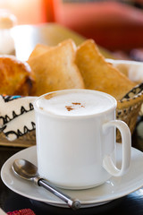 Hot Coffee with Bread in background