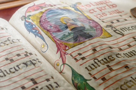 Medieval ancient illuminated manuscript with gregorian chant mus
