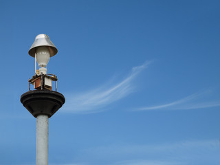 Fototapeta na wymiar Light pole under the blue sky.