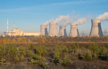 Fototapeta na wymiar nuclear power station and smoke from the chimney