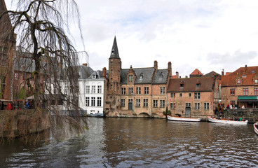 The main part of old town during a cloudy raining day in Bruges