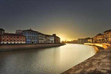 Naklejka premium Pisa, Arno river sunset. Lungarno view. Tuscany, Italy