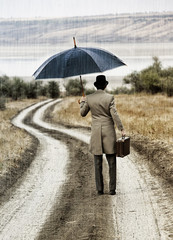 Retro style man under the rain, view from back