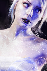 Unusual girl with bright fashion makeup, creative body art on theme space and stars