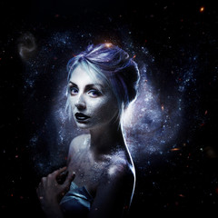 Unusual girl with bright fashion makeup, creative body art on theme space and stars. Elements of...