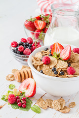 Breakfast - cereal and berries in white bowl