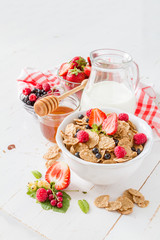 Breakfast - cereal and berries in white bowl