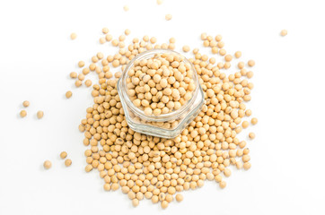 soybeans in glass jar on white background..