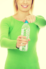 Woman holding a bottle of water.