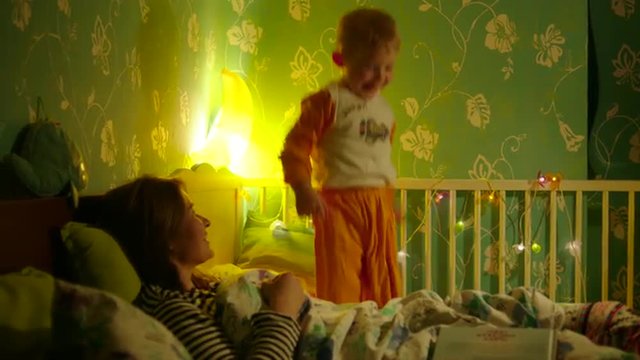 Boy Jumping in Bed