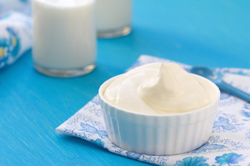 Fresh dairy products on a blue wooden table