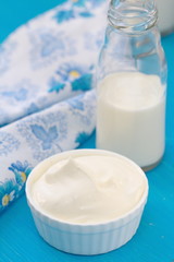 Fresh dairy products on a blue wooden table