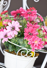 Close up of colorful artificial flowers.