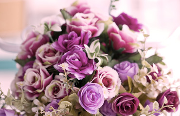 Close up of colorful artificial flowers.