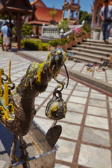 candles and incense in front of the temple