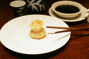 Chinese dumpling with chopsticks