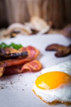 Egg with bacon and mushrooms