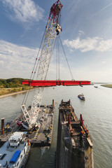 Swimming Crane in action during bridge deconstruction