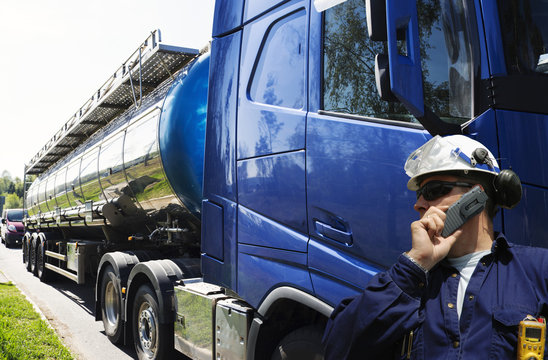 fuel truck and driver, tanker truck delivering fuel and oil