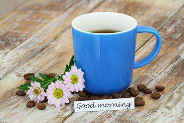Good morning card with mug of coffee, pink daisies with copy space

