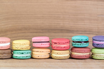 Stack Focus Image Of Colorful French Macarons On Wooden backgrou