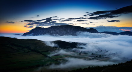 Fototapeta na wymiar beautiful mountain landscape in foggy morning in Alba, Romania