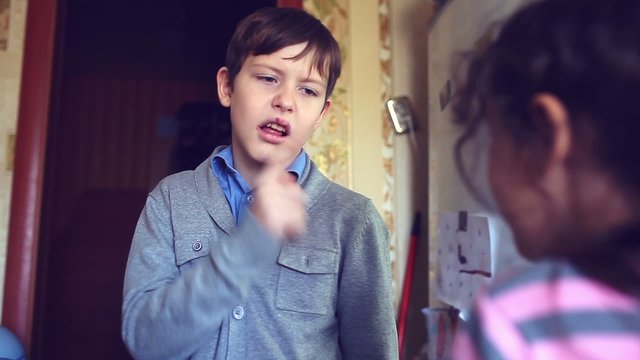 boy and girl teens shout dispute swear evil family conflict