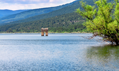 destruction of old bell tower of submerged village Muedra  forma