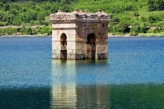 destruction of old bell tower of submerged village Muedra  forma
