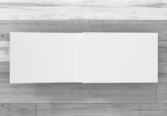 Magazin Doppelseite offen auf Holz