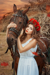 Fototapeta premium Girl hugging a horse's head.