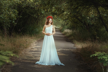 Fairy girl standing on the road in woods. - obrazy, fototapety, plakaty