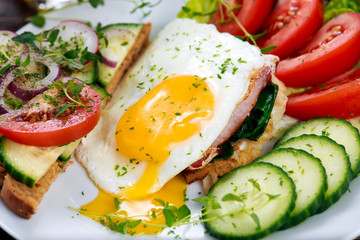 Morning Breakfast - vegan toast sandwich, egg, bacon, and vegetables