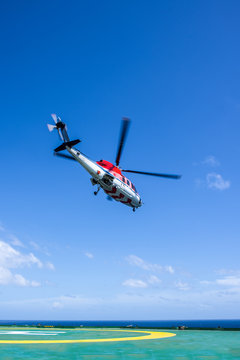 Helicopter take off from oil rig