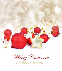 Colorful christmas decoration baubles on white with space for text