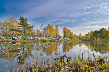 Lonely boats on theshore of the lake, Autumn in Belarus