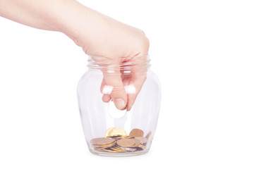 image of female hand putting a coin into glass bottle