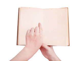 overhead view of hands holding a old book