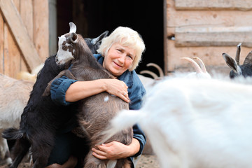 Woman farmer with goats