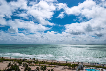 Aerial View coastline Miami Beach Florida USA on a sunny day. People outdoor in luxury tourism resort for summer vacation in tropical paradise