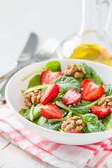 Strawberry salad in white bowl