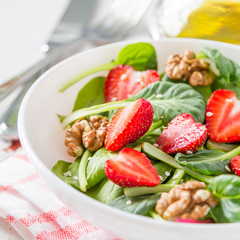 Strawberry salad in white bowl