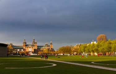 Fototapeta premium Amsterdam museum square sun and clouds