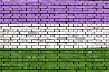 Genderqueer pride flag painted on brick wall