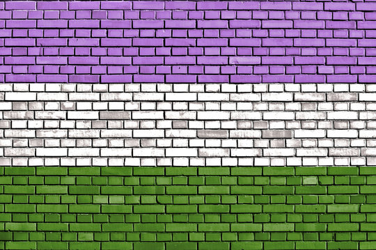 Genderqueer pride flag painted on brick wall