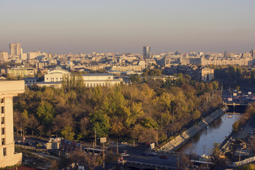 Fototapeta premium Bucharest , Romania - November 4, 2015 – Bucharest, the capital of Romania - view from above, over Dimbovita river at sunset.