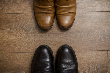 Brown leather shoes on a wooden floor 