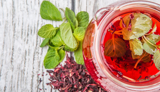 Hot hibiscus tea with fresh mint leaves