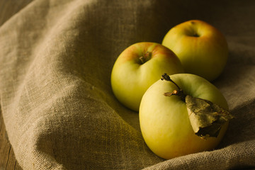 Tree apples on linen cloth